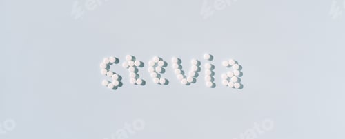 Preview: The word stevia from sweetener in tablets over a blue background