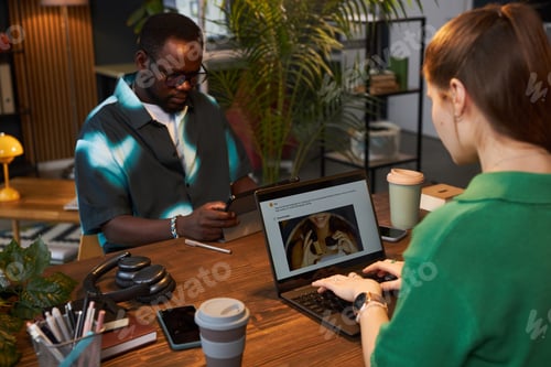 Preview: Woman Using AI-powered App On Laptop