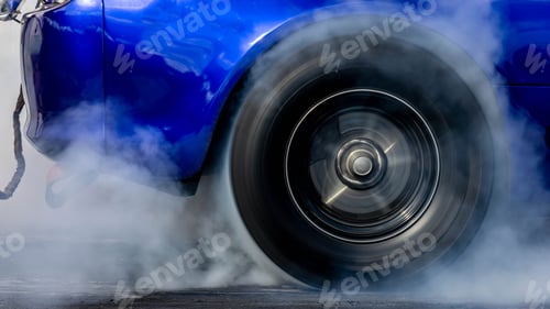 Preview: Car burnout wheels tire with white smoke,Car wheel burnout with smoke from the spinning tyre.