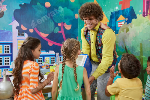 Preview: Happy kids and animator playing on Birthday party.