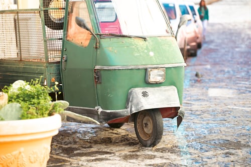 Preview: Old three wheeled car on a street of Procida Island, Italy