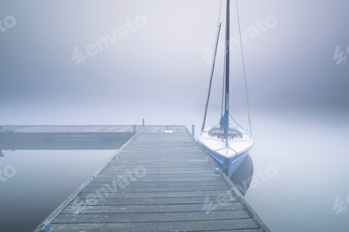 Preview: yacht on peer in dense fog