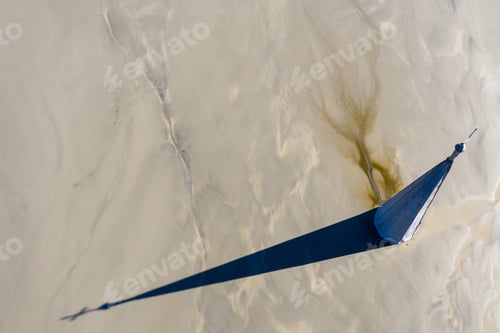 Preview: Abstract Aerial View of Church Tower with Cross and Shadow, Flooded by Copper Mining Residuals