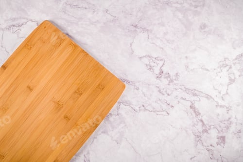 Preview: Wooden cutting board on a gray marble background