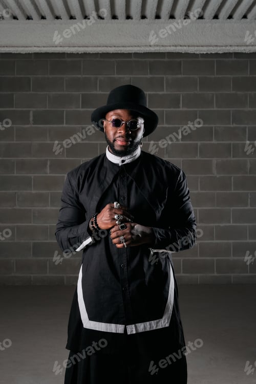 Preview: Black man standing in dark room