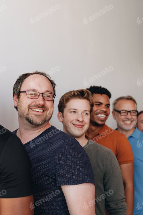 Preview: Happy men standing in a row