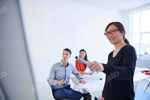Preview: Colleagues in office watching presentation