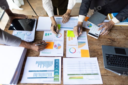 Preview: Business Team Analyzing Data and Charts Together