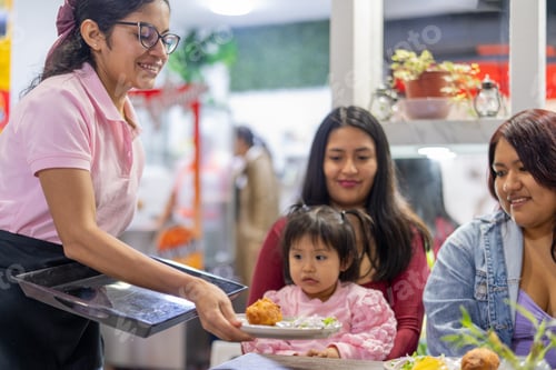 Preview: Latin american waitress serving traditional peruvian food to customers