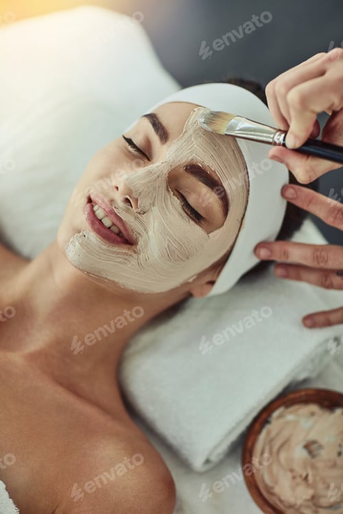 Preview: This is heavenly. Shot of an attractive young woman getting a facial at a beauty spa.