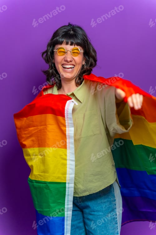 Preview: Non binary happy person wrapped on lgbt rainbow flag