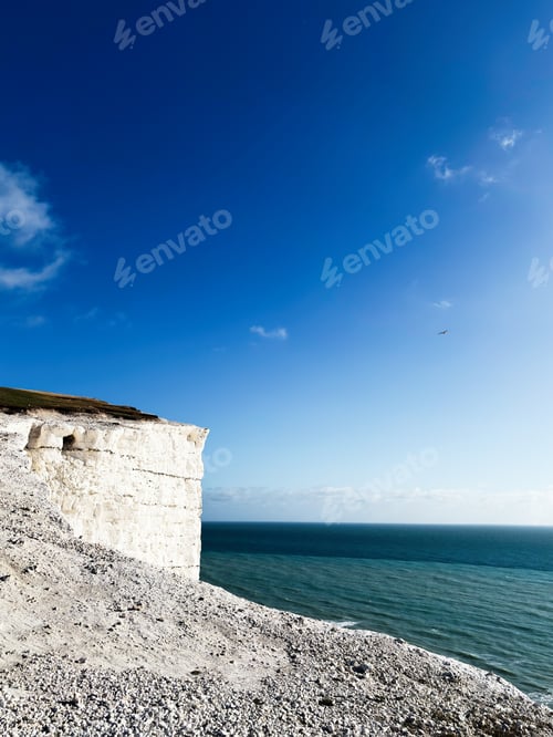 Preview: Cliffs at Seven Sisters in East Sussex overlook the sea under a clear blue sky