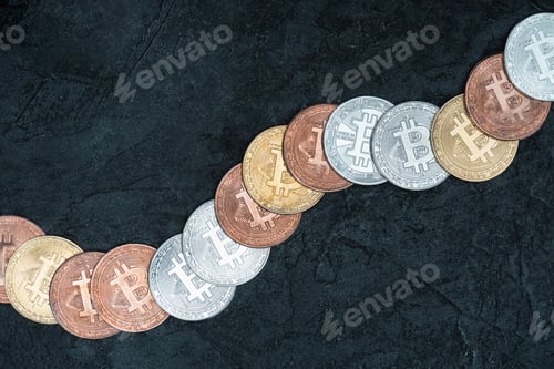 Preview: top view of arranged bitcoins on dark marble tabletop