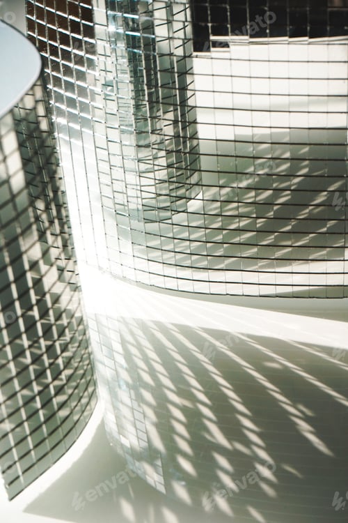 Preview: Elegant background of walls of pieces of mirror and the sun light