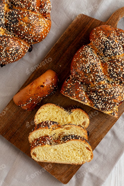 Preview: Homemade Challah Bread covered with Poppy and Sesame Seeds, top view.