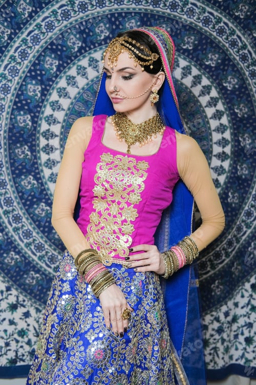 Preview: Portrait Of A Female Model In Ethnic Indian Costume With Jewellery And Traditional Makeup.
