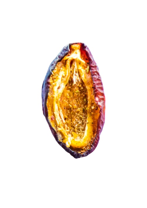 Preview: Dried plums on a white background. Selective focus.