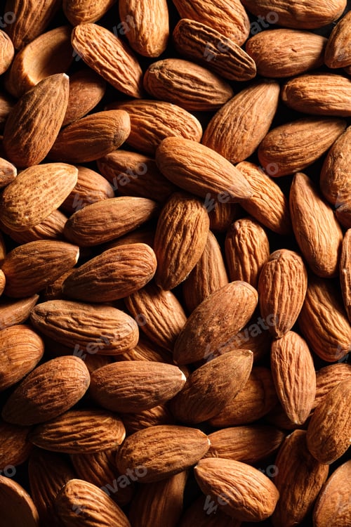 Preview: Food background of almond nuts closeup. Flat lay composition. Healthy protein snack.