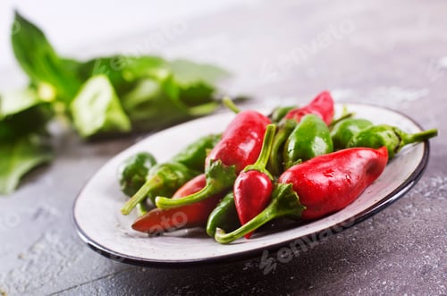 Preview: Chilli peppers over gray background