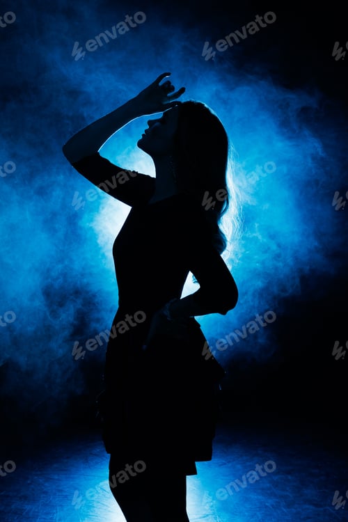 Vista previa: Silhouette of a girl in smoke on a blue background.