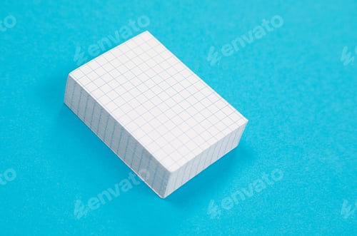 Preview: A pile of white scratch paper is lying on azure surface isolated