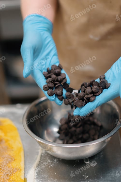 Preview: The kitchen in the bakery - the process of making cinnabons, woman baker uses chocolate in granules