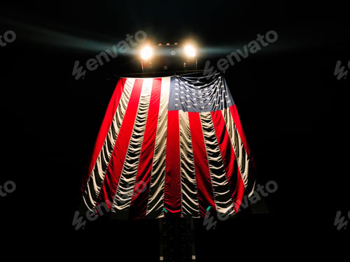 Preview: Closeup shot of the flag of the USA on the dark background