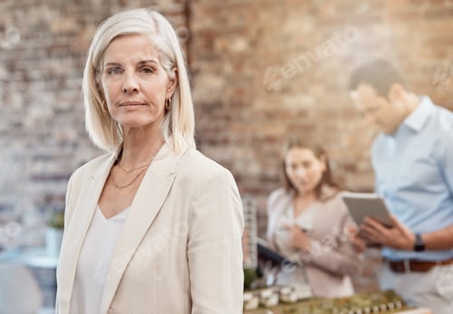 Preview: Serious, confident and executive professional or manager leading her busy team in planning. Mature