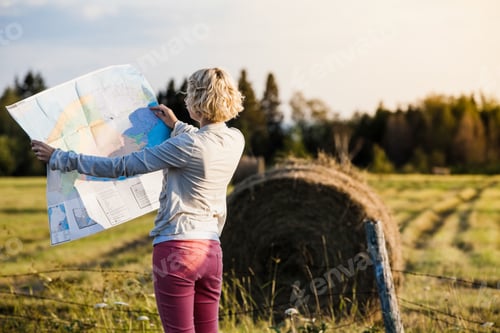 Preview: Lost Woman on a Rural Scene Looking at a Map
