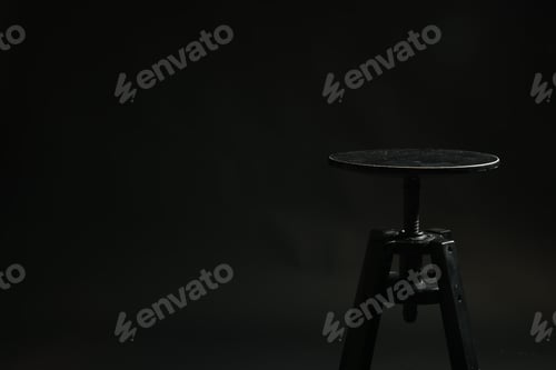 Preview: Bar stool on black background, space for text. Used stuff