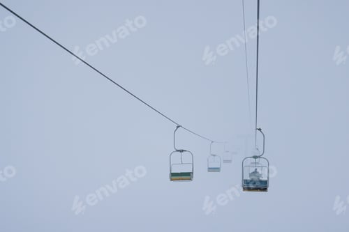 Preview: Cable cars hang on cables in a silent fog