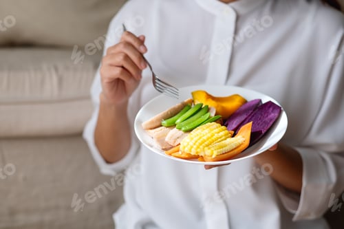 Preview: Closeup image of a woman eating vegetables, Vegan, Clean food, dieting concept