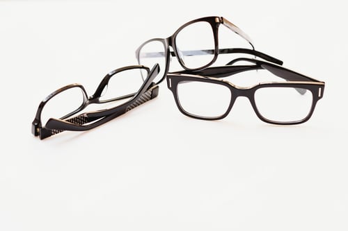 Preview: Stylish eyeglasses over background. Optical store, glasses selection, eye test, vision examination