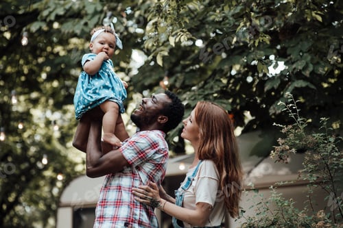 Preview: Loving Family Moment in a Green Suburban Setting