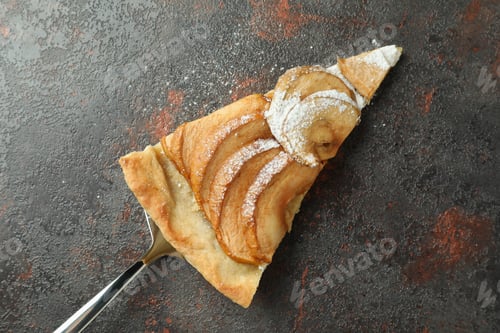 Preview: Cake spoon with slice of apple pie on textured background