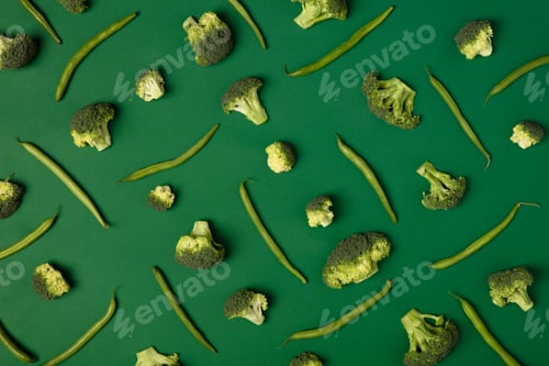 Preview: Colorful pattern of Broccoli and green beans on a green backgrou