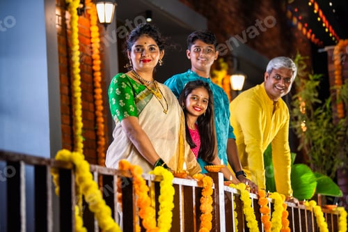 Preview: Family of four arranging clay diyas for Diwali, brightening their home with festive ligh