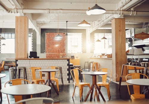 Preview: Interior of empty modern cafe or restaurant during the day. Round tables and yellow chairs in a rus