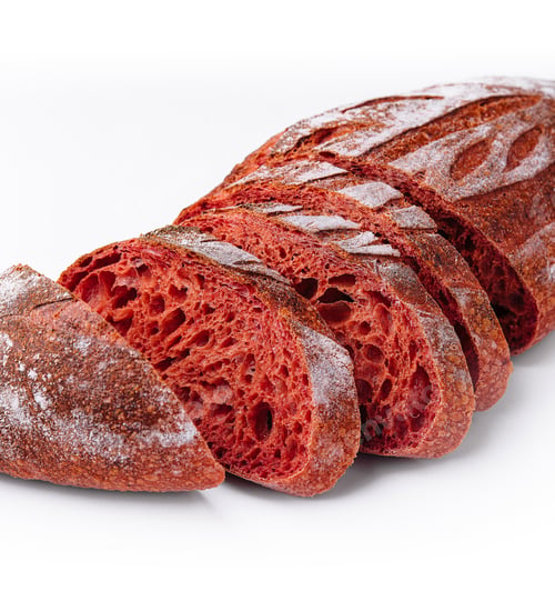 Preview: Sliced beetroot artisan bread on white background