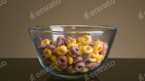 Preview: Close-up of multicolored flakes. Stock footage. Delicious sweet rings painted in different colors on