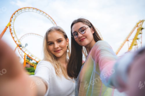 Preview: LGBT concept, Young women at Amusement theme park enjoying
