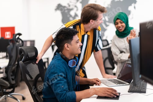 Preview: Multiethnic startup business team woman wearing a hijab on meeting in modern open plan office