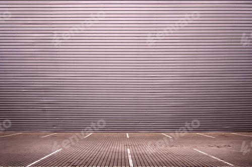 Preview: Empty parking spaces on the background of a metal wall with plenty of free space for product
