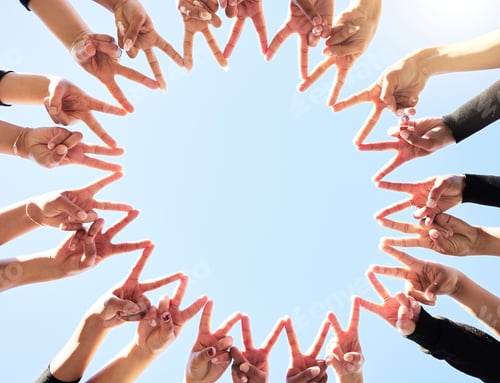 Preview: Shot of a group of people forming star shapes with their hands in a circular formation