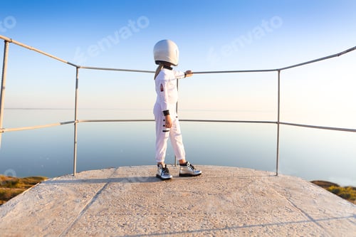 Preview: Astronaut futuristic kid girl with white full length uniform and helmet wearing silver shoes