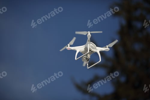 Preview: Drone flies in the blue sky