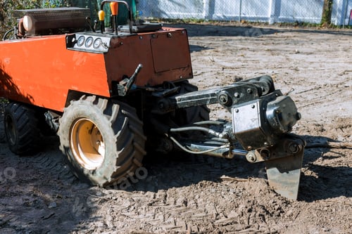 Preview: Ttractor tracked earth working at digging laying of underground pipes