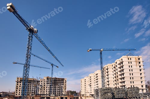 Preview: Construction site with cranes on sky background