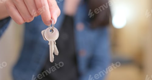 Preview: Woman holding key