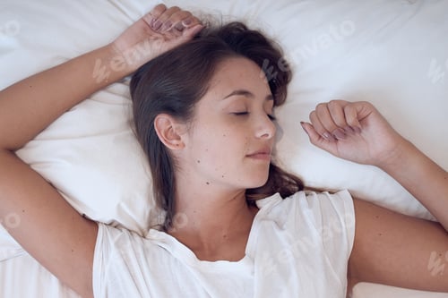 Preview: Dont underestimate the value of doing nothing. Shot of a young female sleeping in bed at home.